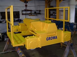 Yellow Growa crane trolley with safety railings in the workshop